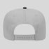 Gray cap with a black button on a light gray background